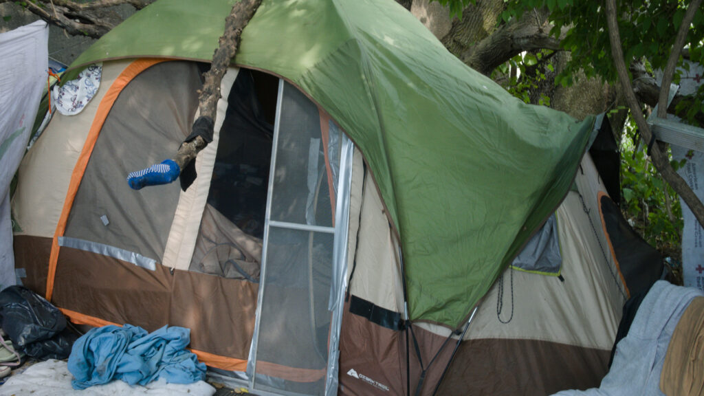 Tent of homeless person with screen door